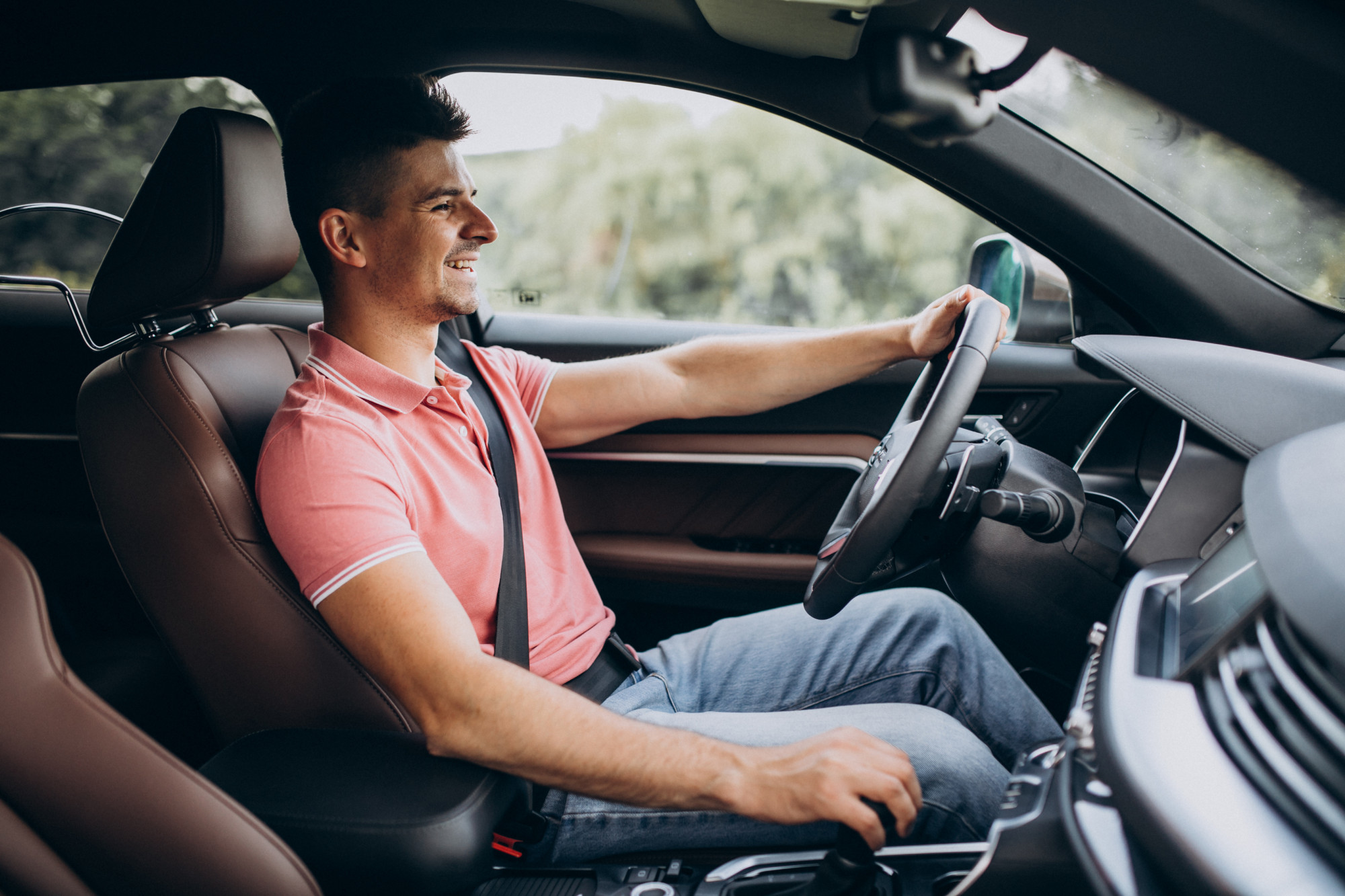 Man driving a car.