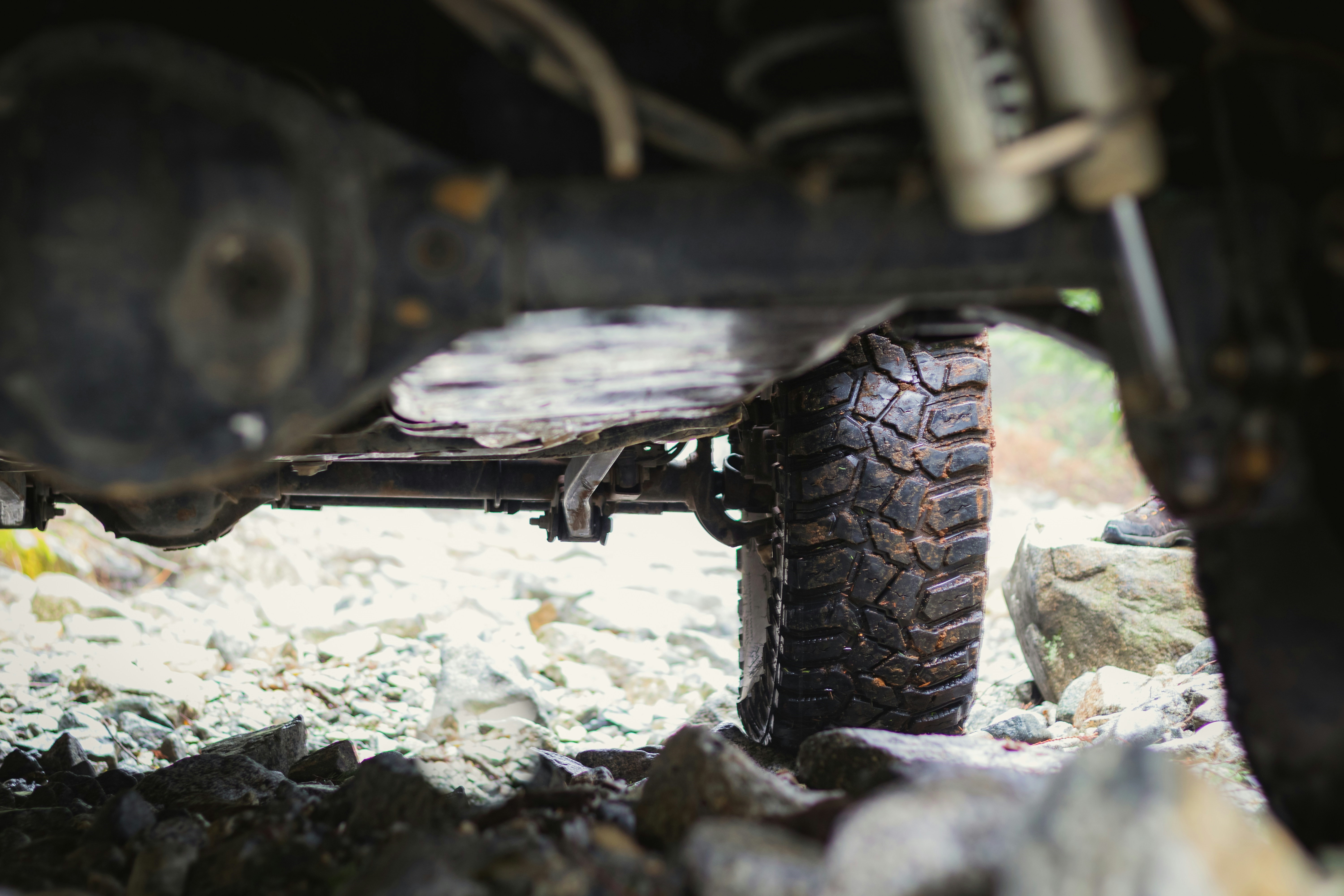 View of a car's suspension system; crucial for stability, comfort, and control on rough roads.