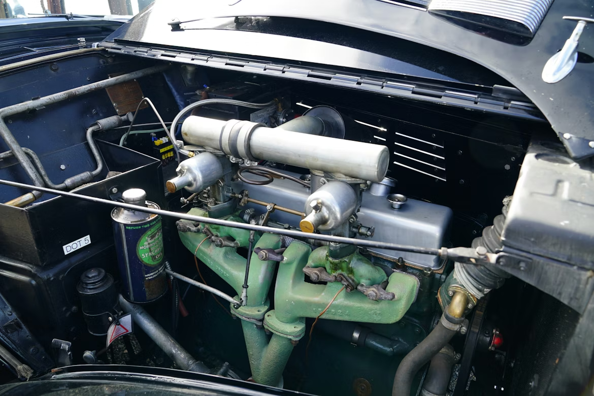 Close-up image of a car engine, focusing on the complex machinery and engine components.