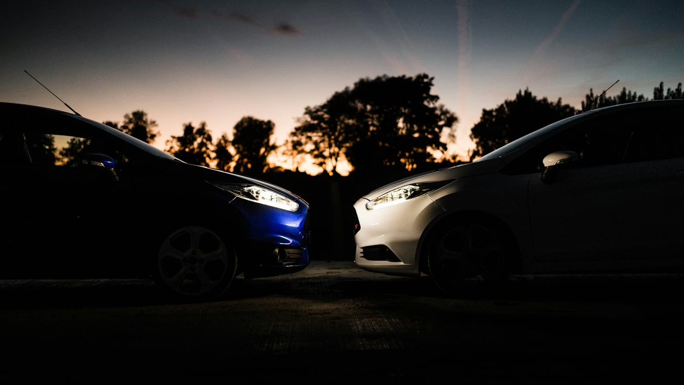 Comparison image of two cars, highlighting their design and performance features side by side.