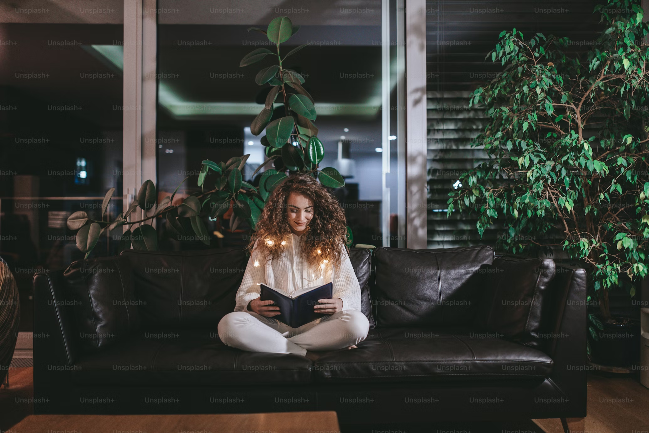 Woman reading a book in a cosy room without distractions