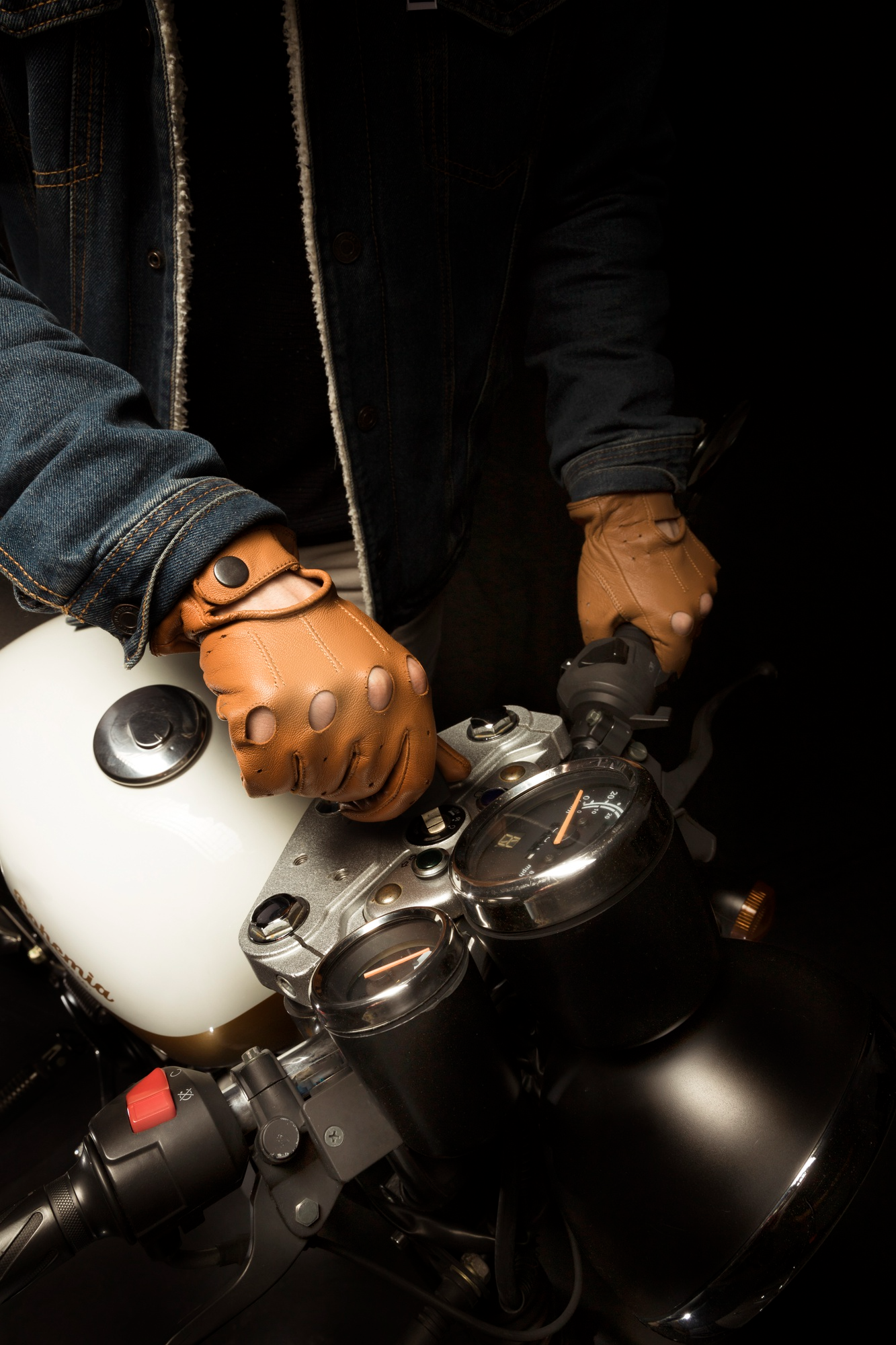 Man on cafe racer style motorbike.
