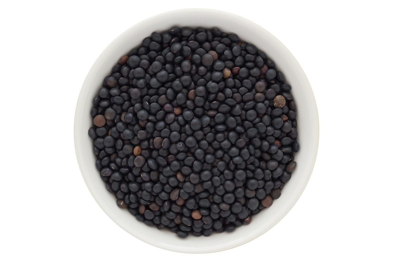 A cup containing black lentils