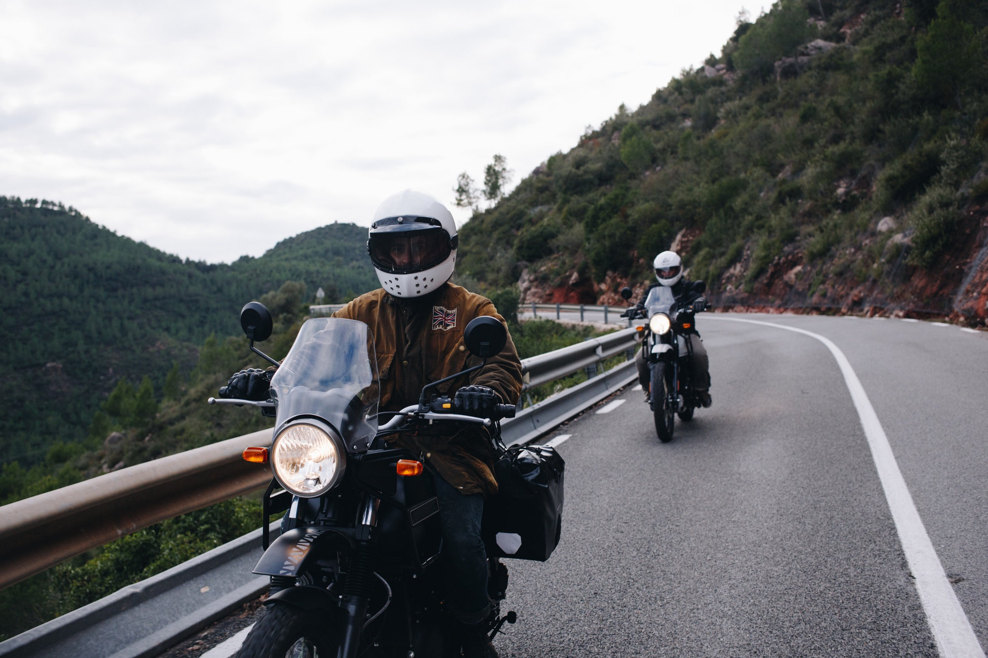 Bike riders on a mountainous road.