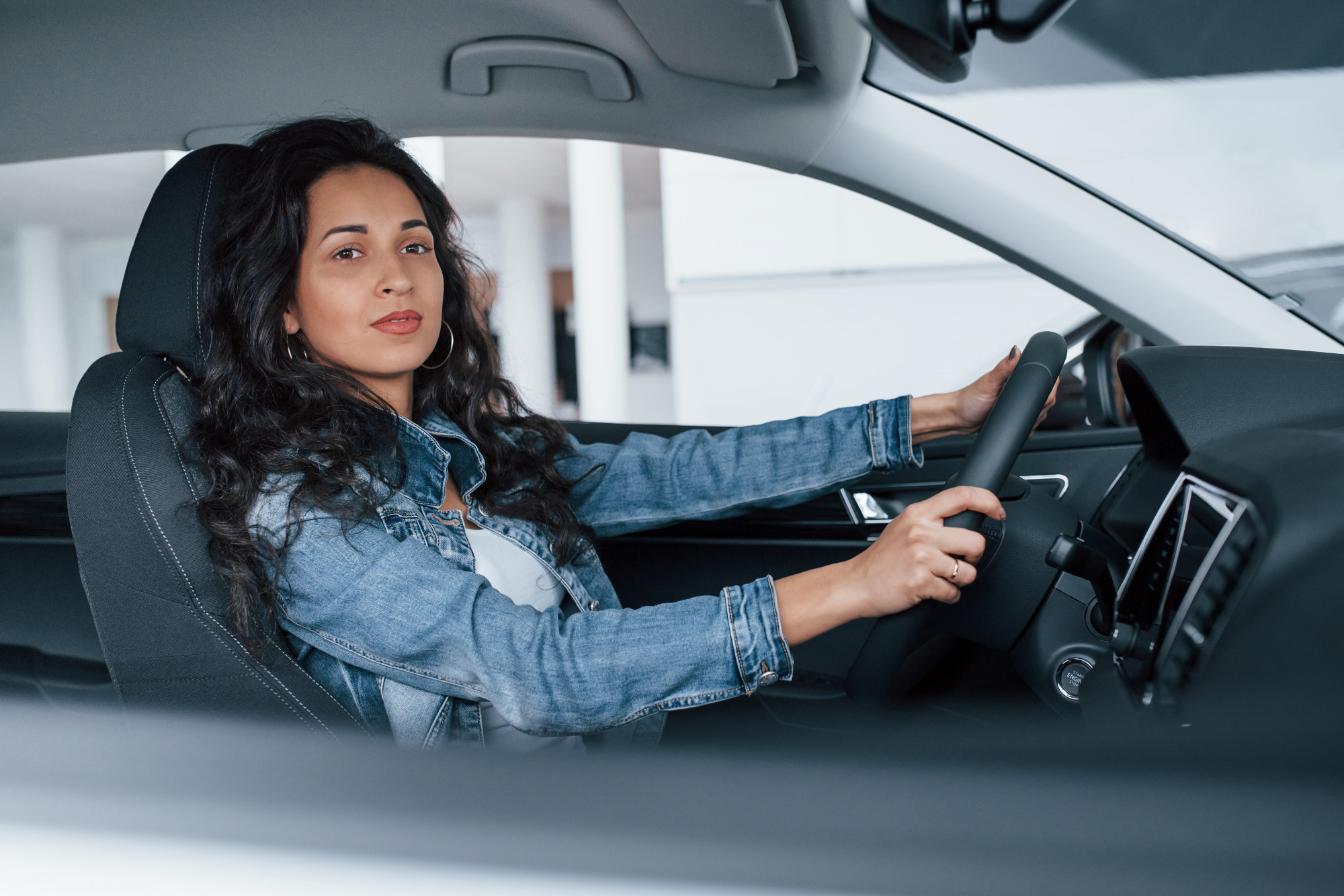 A woman driving a car.
